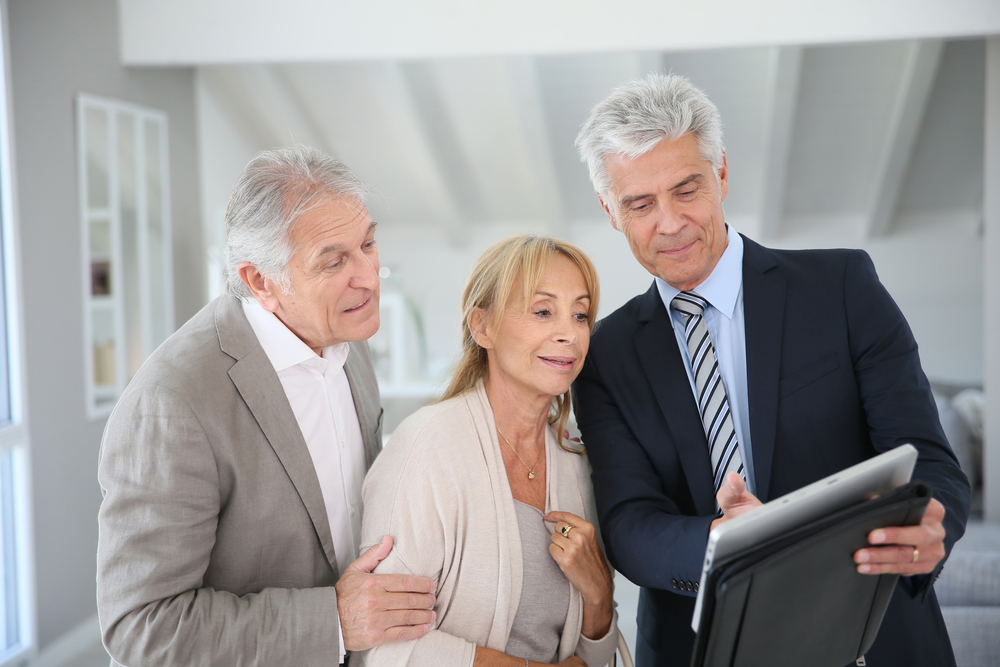 Senior couple with estate planning advisor